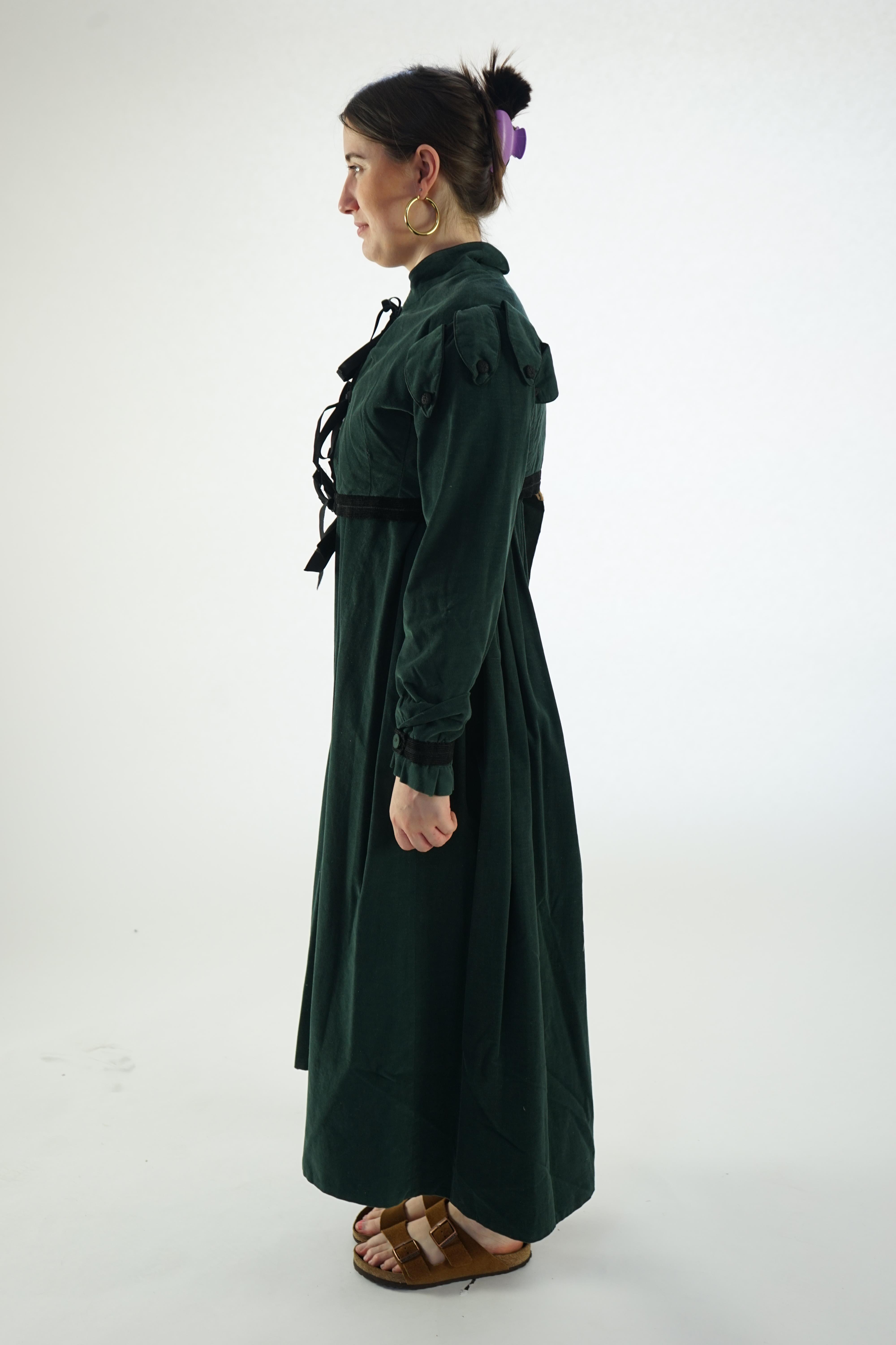 Two lady's Regency style day dresses (1 x dark green taffeta dress with brown short jacket and 1 x bottle green fine cord day dress and short matching jacket)., Ex Carl Rosa Opera Company.